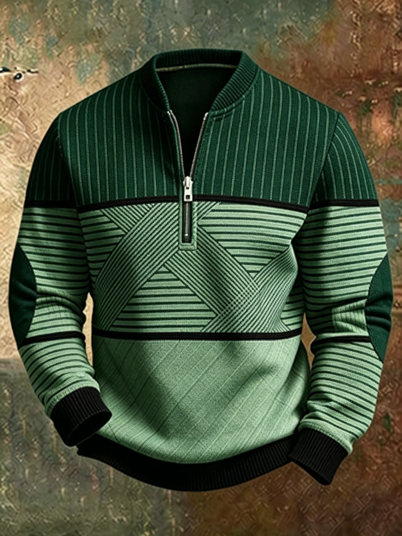 Sweater i mørkegrøn og lysegrøn med striber, grafisk mønster over maven, sorte manchetter og halv lynlås, set forfra. 5