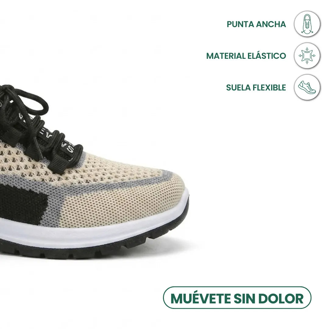 Nærbillede af sneakerens brede tå i beige åndbart mesh med grå og sorte detaljer, hvid sål og snørebånd, med ikoner for komfort. 41