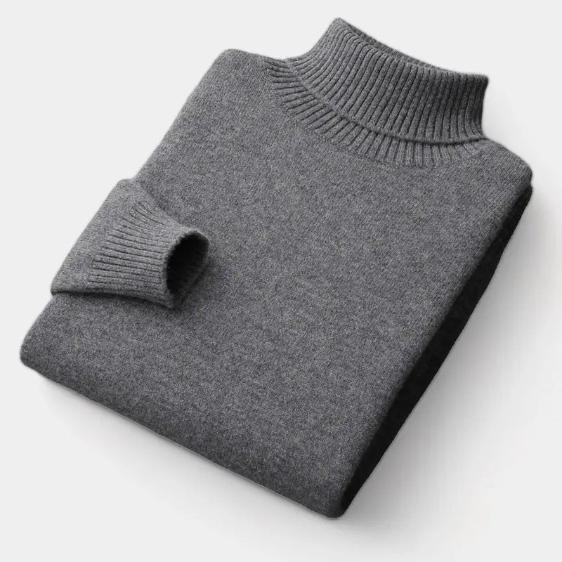 Foldet mørkegrå rullekravesweater, set fra siden med ribstrikket krave og manchet 3