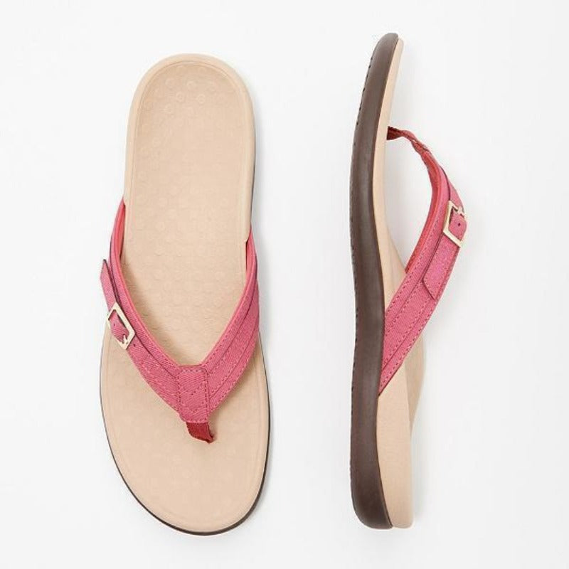 Lyserød sandal med guldfarvet spænde set ovenfra og fra siden, beige formstøbt fodseng 6