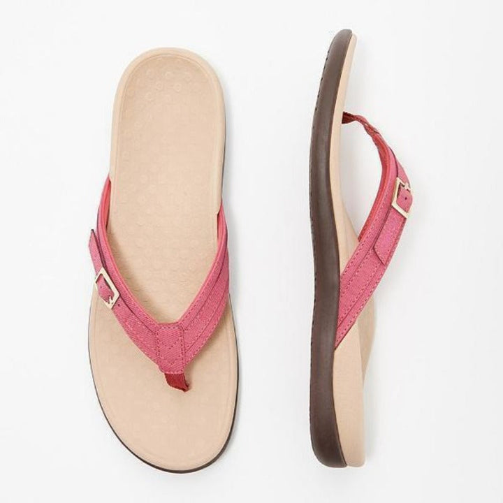 Lyserød sandal med guldfarvet spænde set ovenfra og fra siden, beige formstøbt fodseng 6
