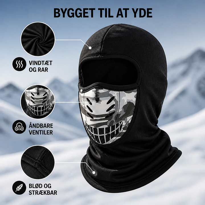 Sort ansigtsmaske set skråt forfra med forstørrede detaljer af stoffet, ventilationsåbningerne og de bløde sømme. 4