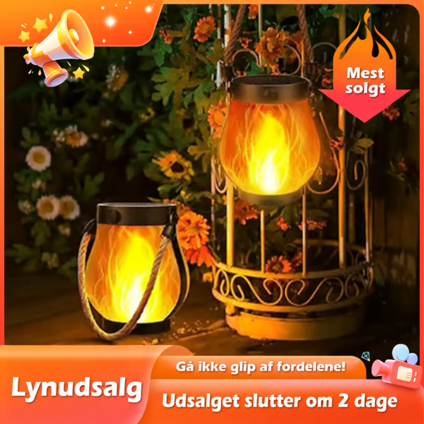 To lanterner med glødende flammeeffekt, den ene hængende i et dekorativt bur blandt blomster 2