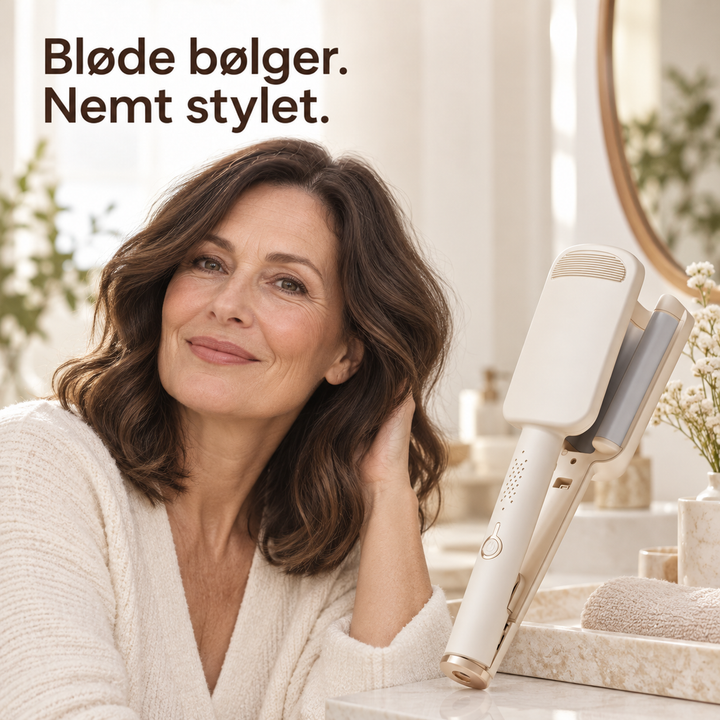 Smilende kvinde med brune bølgede hår ved et badeværelsesbord ved siden af det beige bølgejern 1