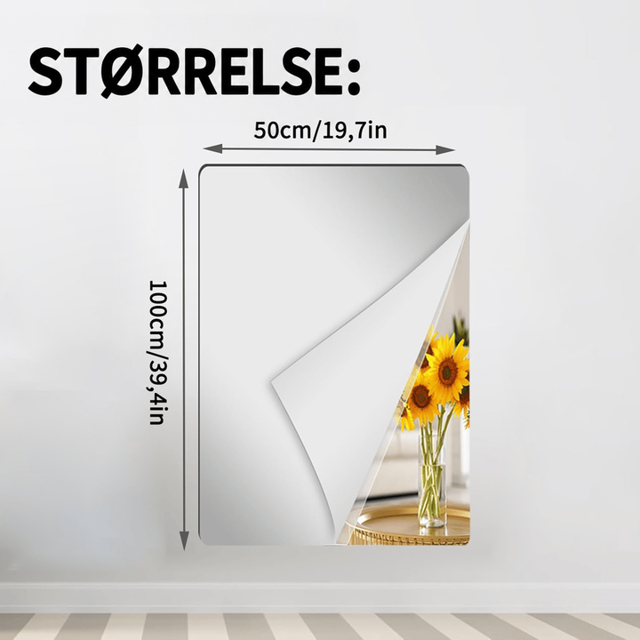 Rektangulært spejlark med oprullet hjørne på en lys væg, der viser solsikker i en vase, med målpile for bredde og højde. 12