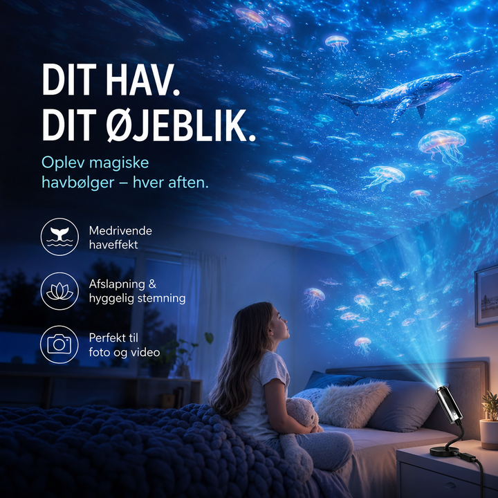 Pige i seng kigger op mod loft og væg fyldt med projicerede vandmænd og hval 3