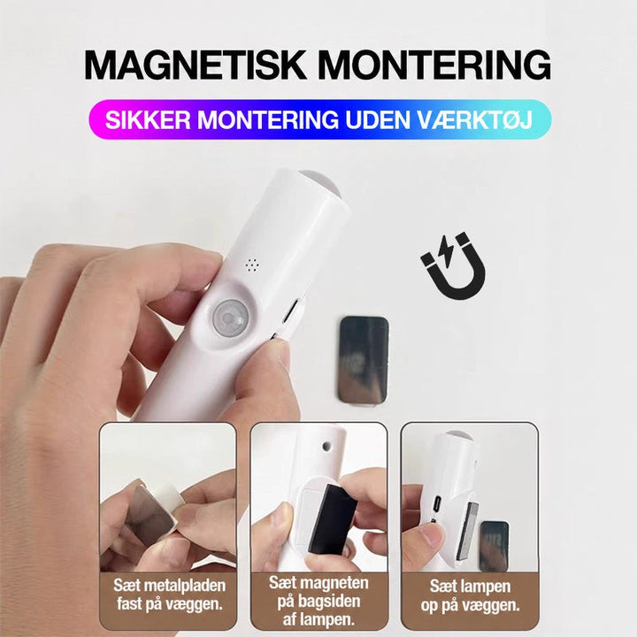 Hænder monterer lampen magnetisk på væggen i tre trin med metalplade, magnet og lampe 11